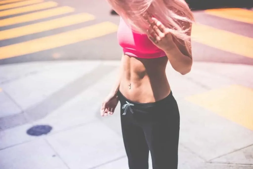 Woman with toned stomach after LA-EMS Body Sculpting Treatment Stoke