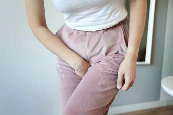 woman running for the toilet because of urinary incontinence Stoke